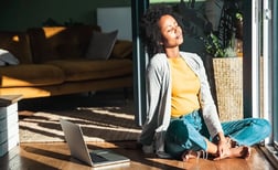 female-sitting-in-sunlight-indoors-HS