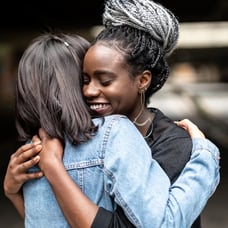 two-women-hugging